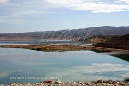 Image du Maroc Professionnelle de  Le barrage Laghrasse "dit barrage Hassan II", il se situe à 50 km au sud est de Taourirte au nord du Maroc, Samedi 10 Février 2006, ce barrage fournit en eau potable  le barrage Mohammed V qui sert de lien pour Machraa Hammadi,  ce dernier permet l'approvisionnement des centre de Taourirte et El Aïoun Sidi Mellouk. (Photo / Abdeljalil Bounhar) 